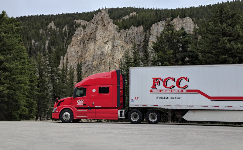 Beautiful View of Fremont Contract Carriers truck at Yellowstone National Park taken by our driver Brenda Holman which is most suited for our calendar Cover