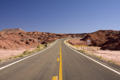 Empty Desert Highway in Utah with Mountains