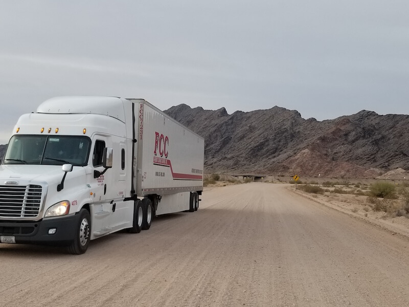 Charming view of Fremont Contract Carriers truck at Roll, Arizona taken by our driver Rick Waldrop which is most suited for our calendar for the month of July.