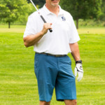 2018 FCC Annual Golf Tournament participant with club over shoulder