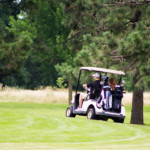 2018 FCC Annual Golf Tournament golfers driving away