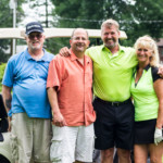 2018 FCC Annual Golf Tournament pose together, smiling