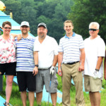 2018 FCC Annual Golf Tournament participants near obstacle course
