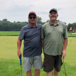 2018 FCC Annual Golf Tournament golfers pose and smile on green