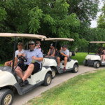 2018 FCC Annual Golf Tournament, carts driving in a line