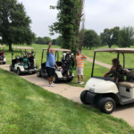 2018 FCC Annual Golf Tournament, golfers waving