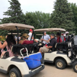2018 FCC Annual Golf Tournament, golfers in carts preparing to leave